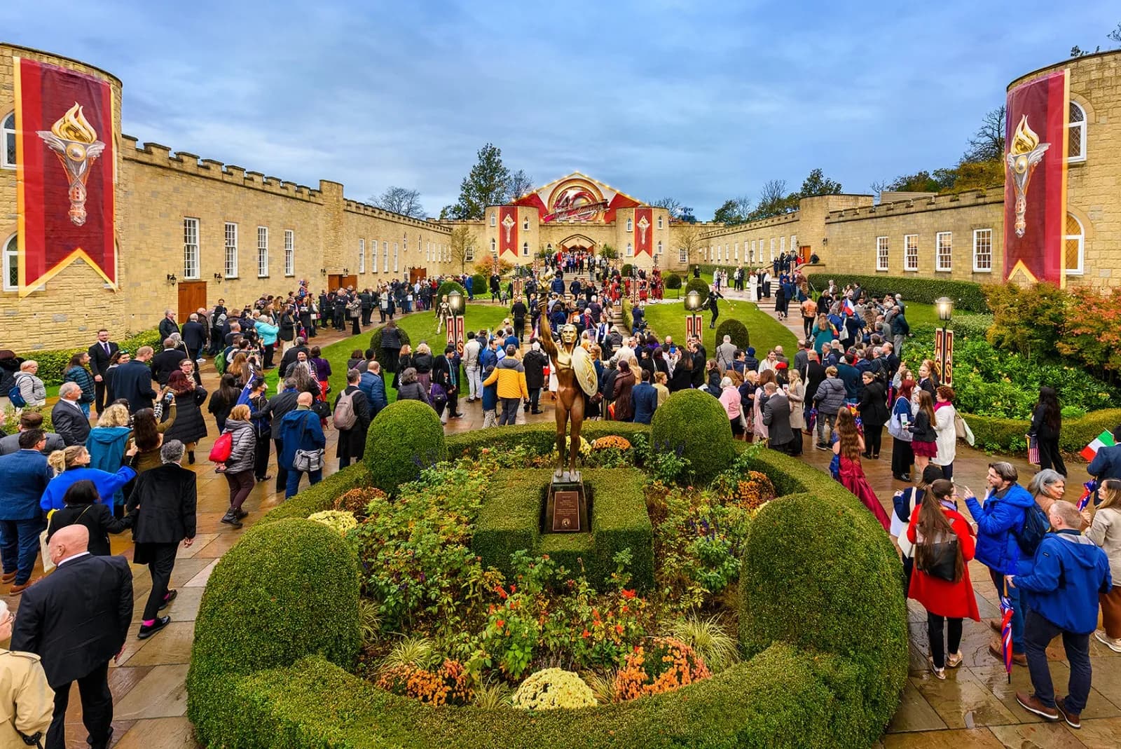 Attendees in the courtyard at Saint Hill